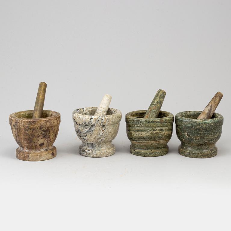 Four swedish green marble mortars and pestles, early 19th century.