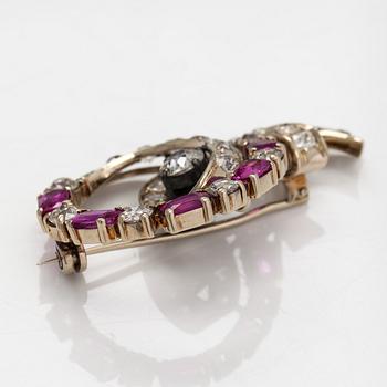 An 18K white gold and silver brooch with old-cut diamonds ca.3.90 ct in total and rubies.