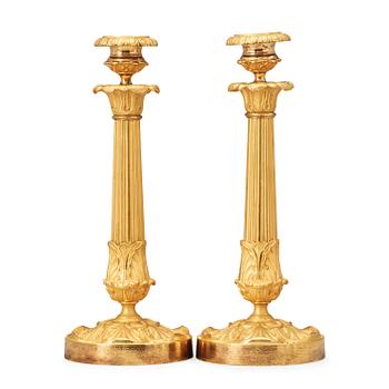 1467. A pair of late Empire 19th century gilt bronze candlesticks.
