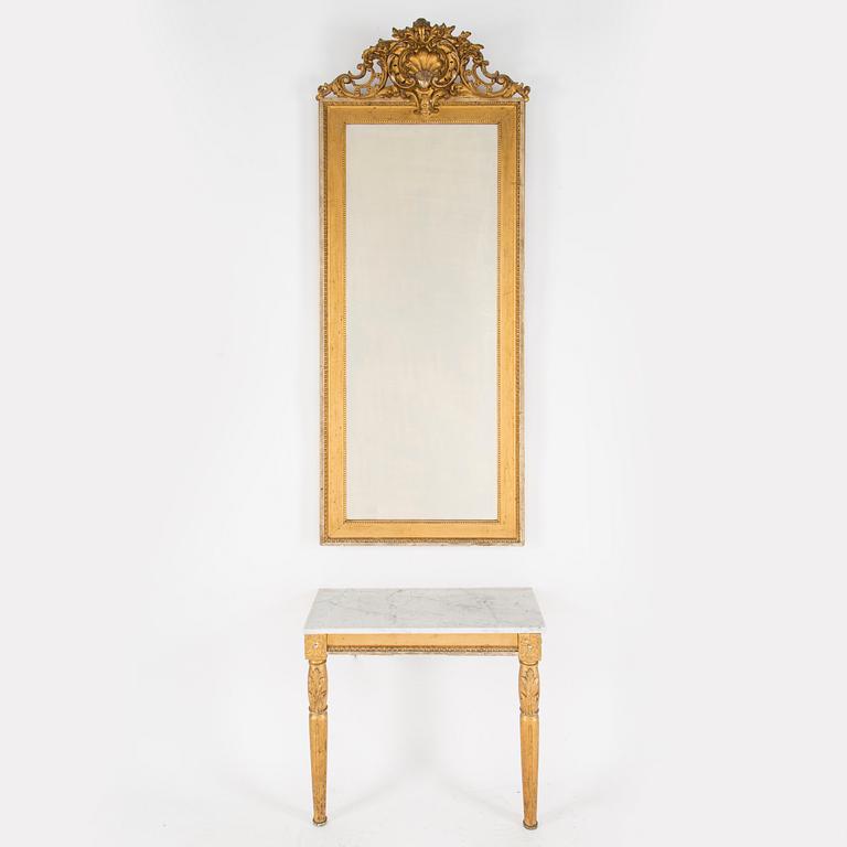 A Swedish Gustavian style mirror and console table with marble top from the first half of the 20th century.