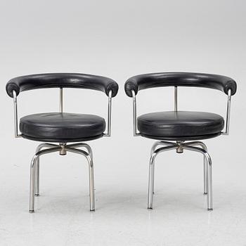 Charlotte Perriand, /Le Corbusier, swivel armchairs, a pair, model LC7, Cassina, Italy, later part of the 20th century.
