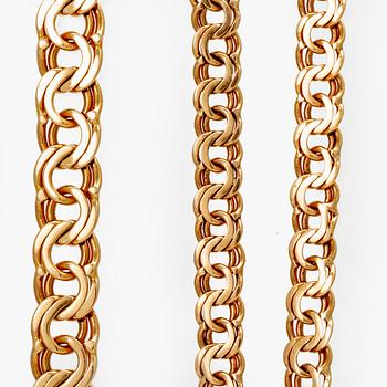 Two 18K gold bracelets.