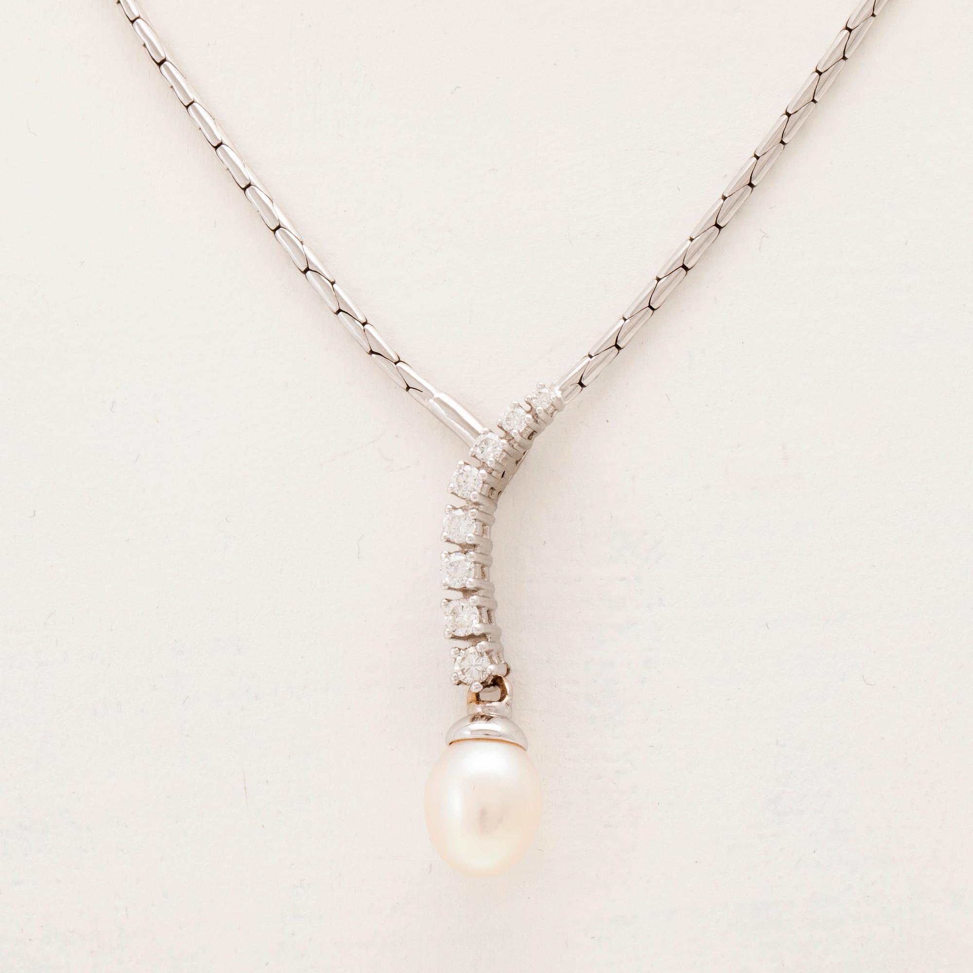 An 18K white gold necklace set with round brilliant-cut diamonds and a cultured pearl.