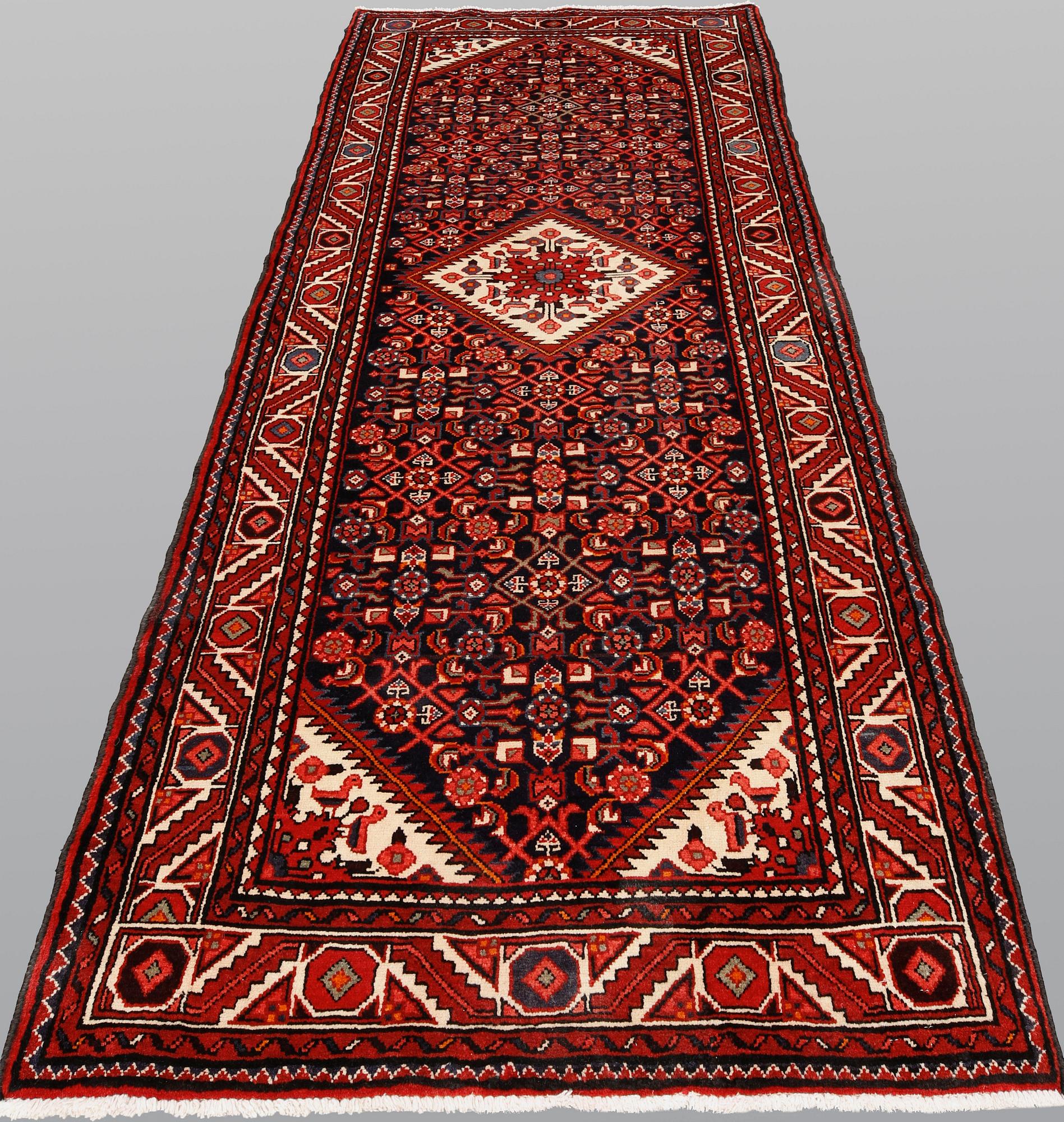 A pictoral Hamadan runner, ca 310 x 115 cm.