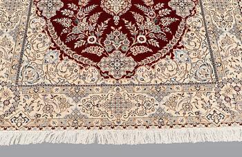 A carpet, Nain part silk s.k 6LAA, 239 x 155 cm.