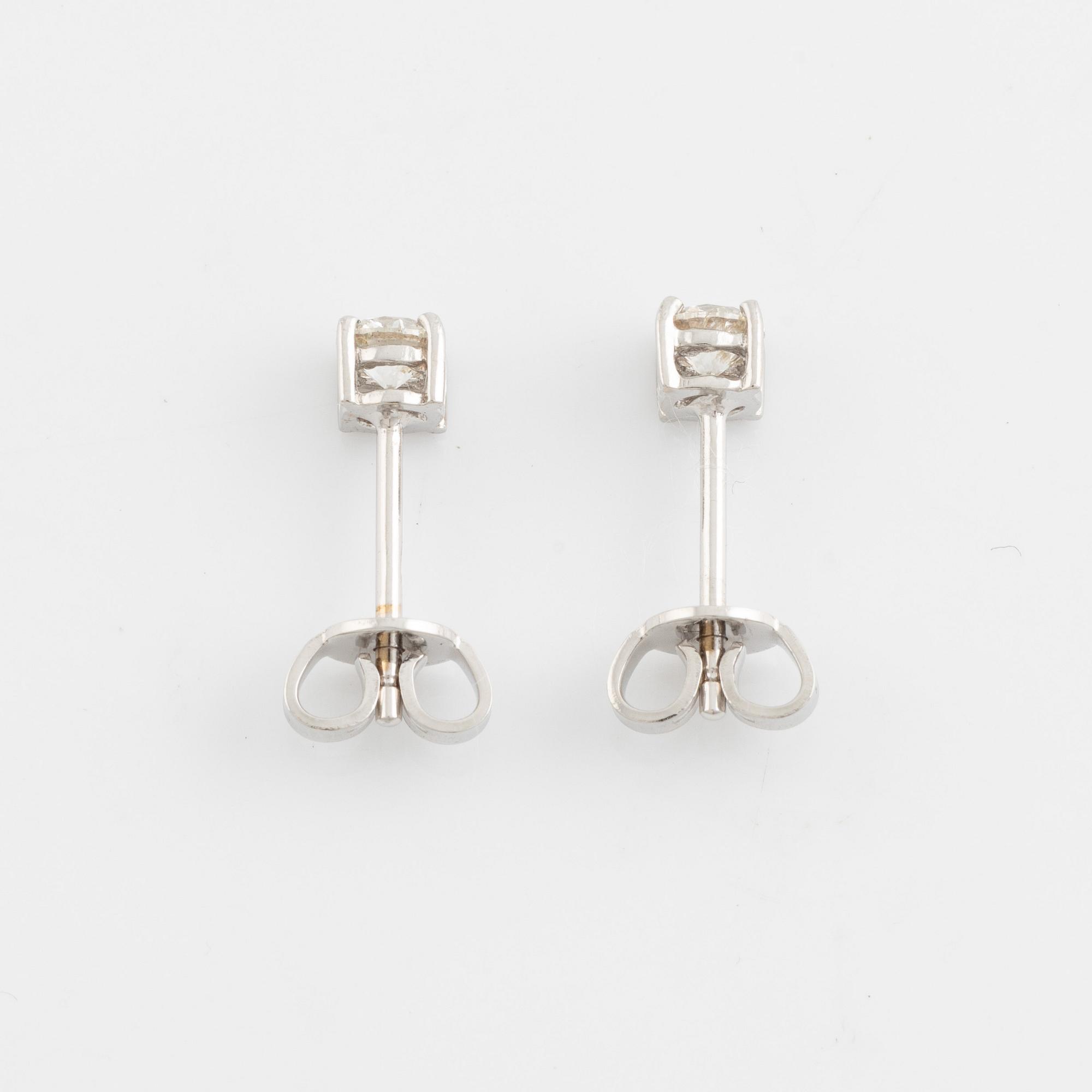Brilliant cut diamond stud earrings.