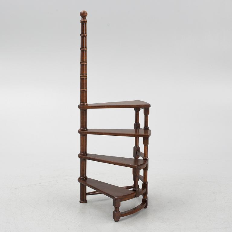A late 20th century spiral library ladder.