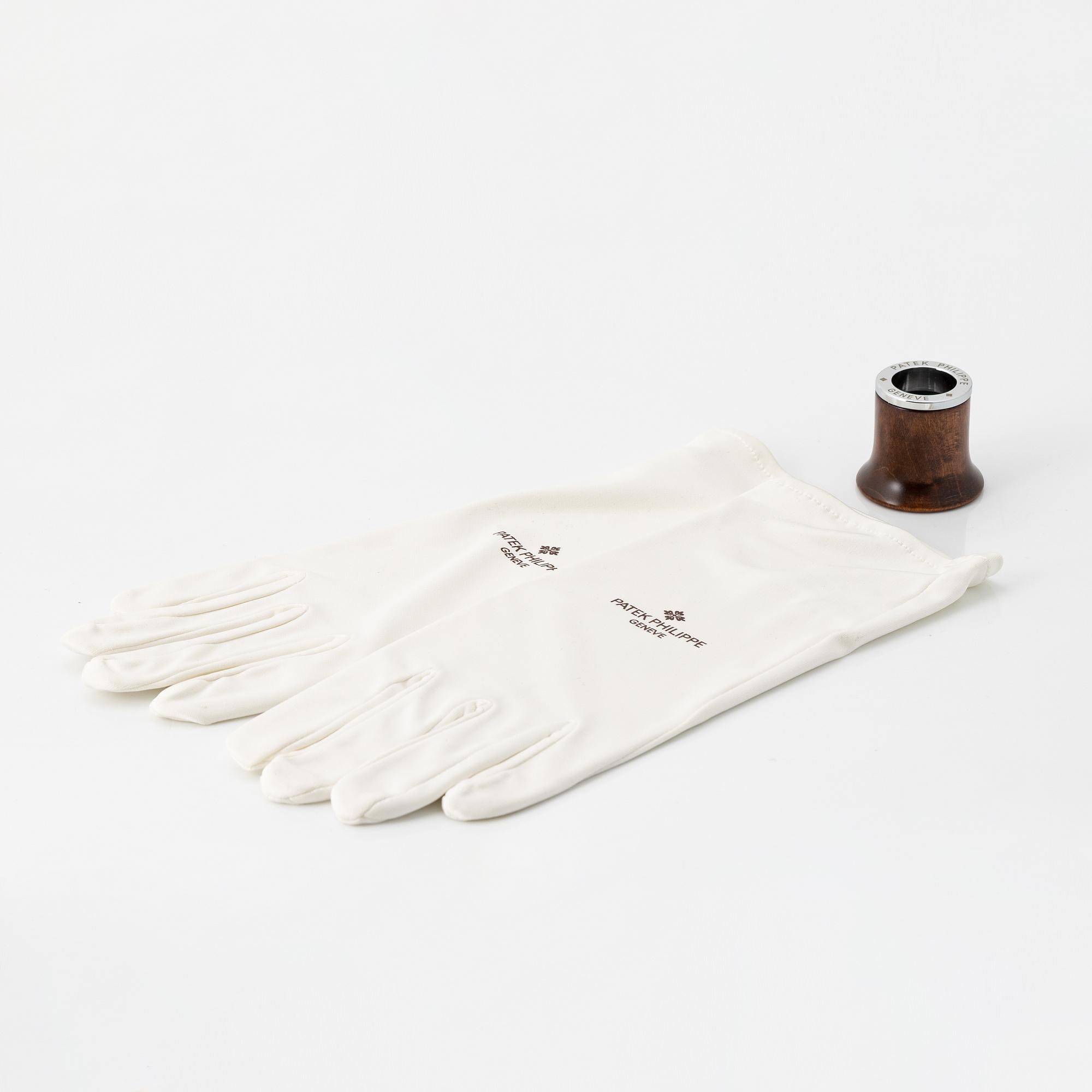 Patek Philippe, loupe, gloves.