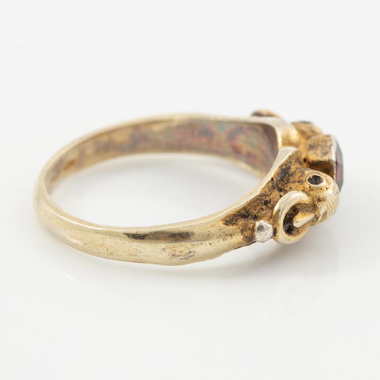 Two rings in silver with pink/red stones.