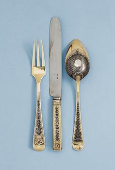 1201. A SET OF THREE RUSSIAN SILVER-GILT AND NIELLO CUTLERY, Moscow 1824.