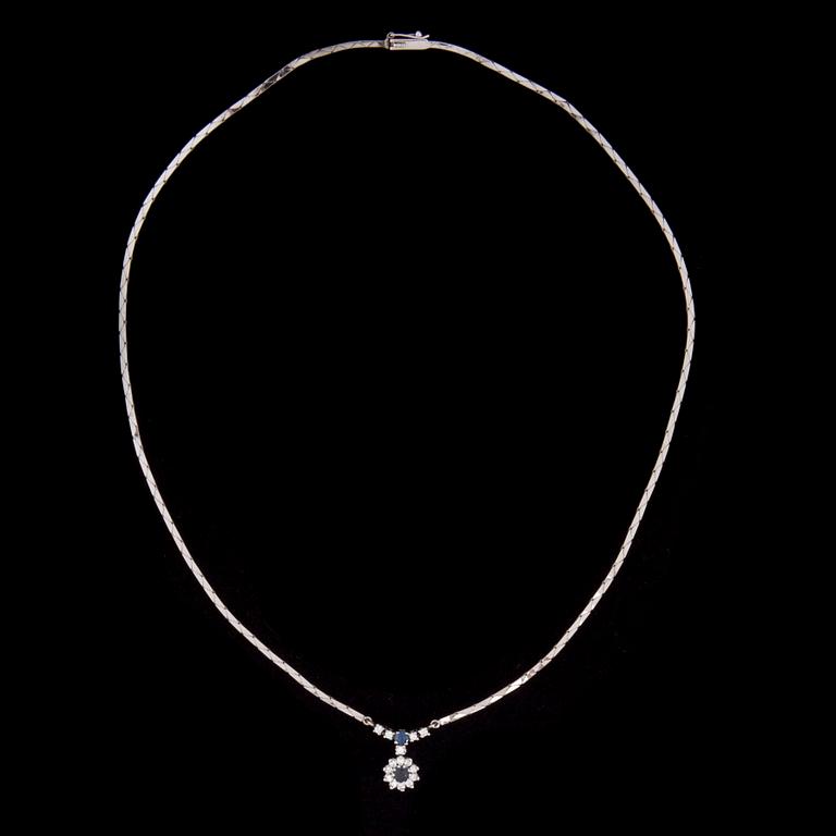 HÄNGSMYCKE, 14K vitguld, 2 safirer, diamanter tot. 0,30 ct. Vikt 10,9 g.