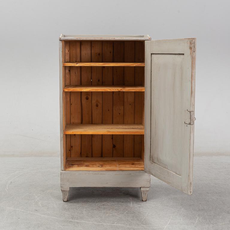 A 20th century gustavian style cupboard.