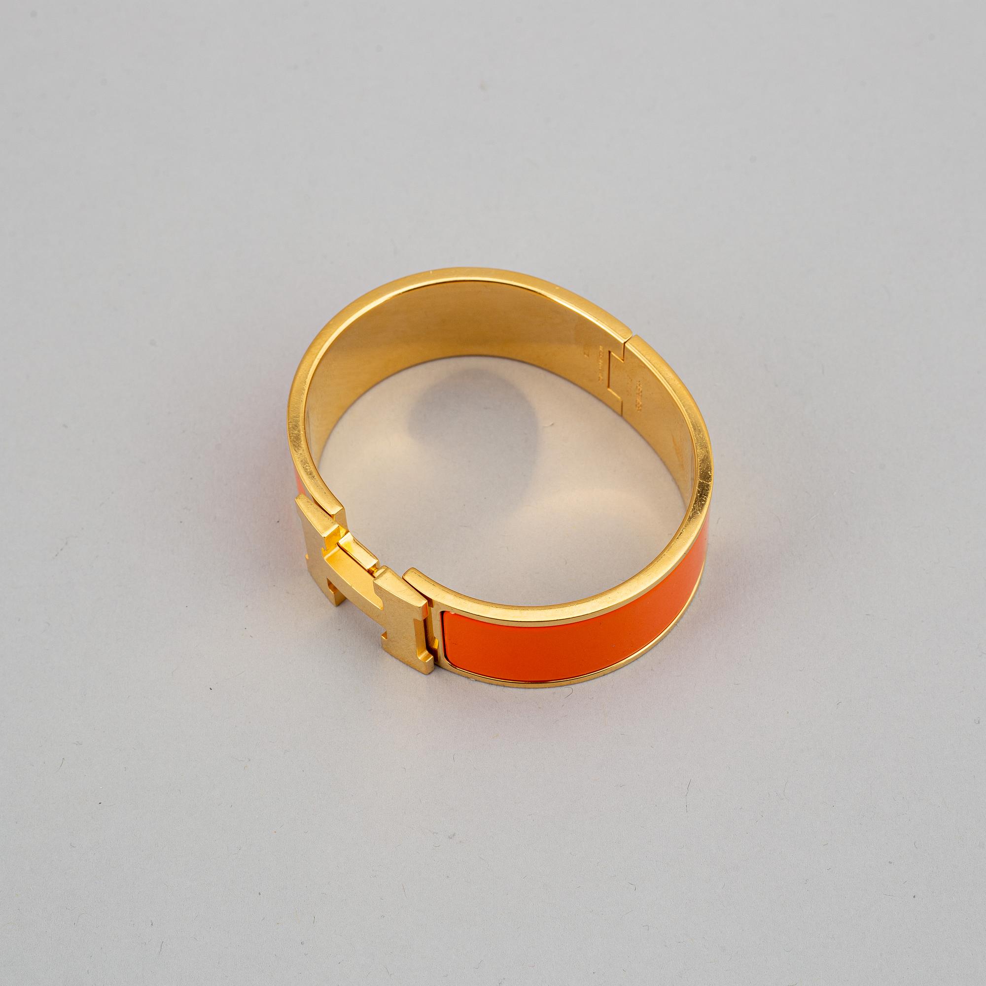 HERMÈS, a 'Clic H' bangle.