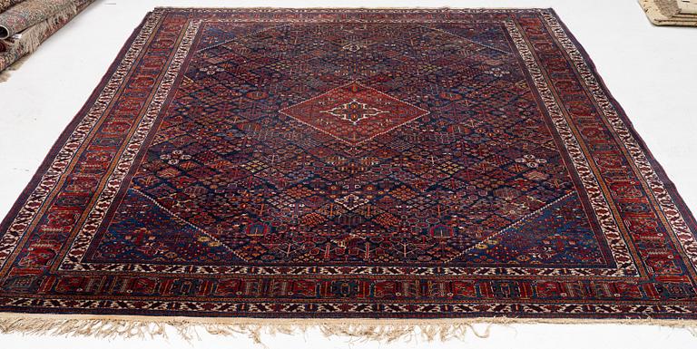 An oriental carpet, c. 360 x 270 cm.