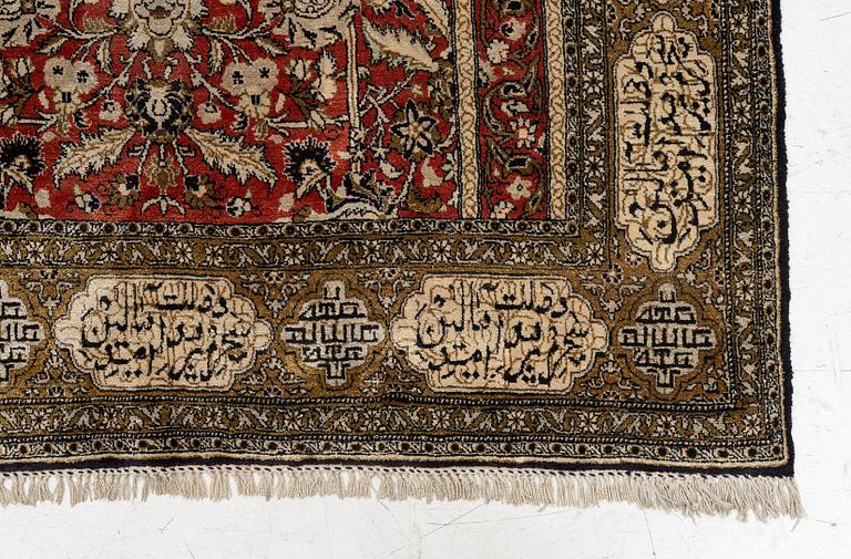 A silk Qum rug, c. 172 x 105 cm.