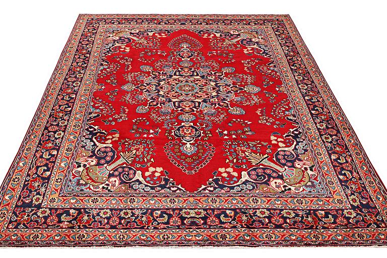 A carpet, Tabriz, ca. 338 x 243 cm.