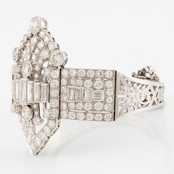 A bracelet in platinum set with baguette and brilliant-cut diamonds, Art Déco.