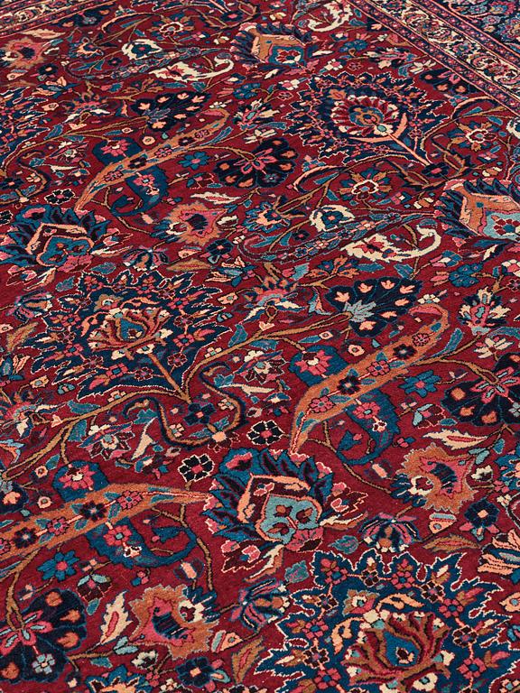 A CARPET, a semi-antique Mashad, ca 400-404 x 314 cm.