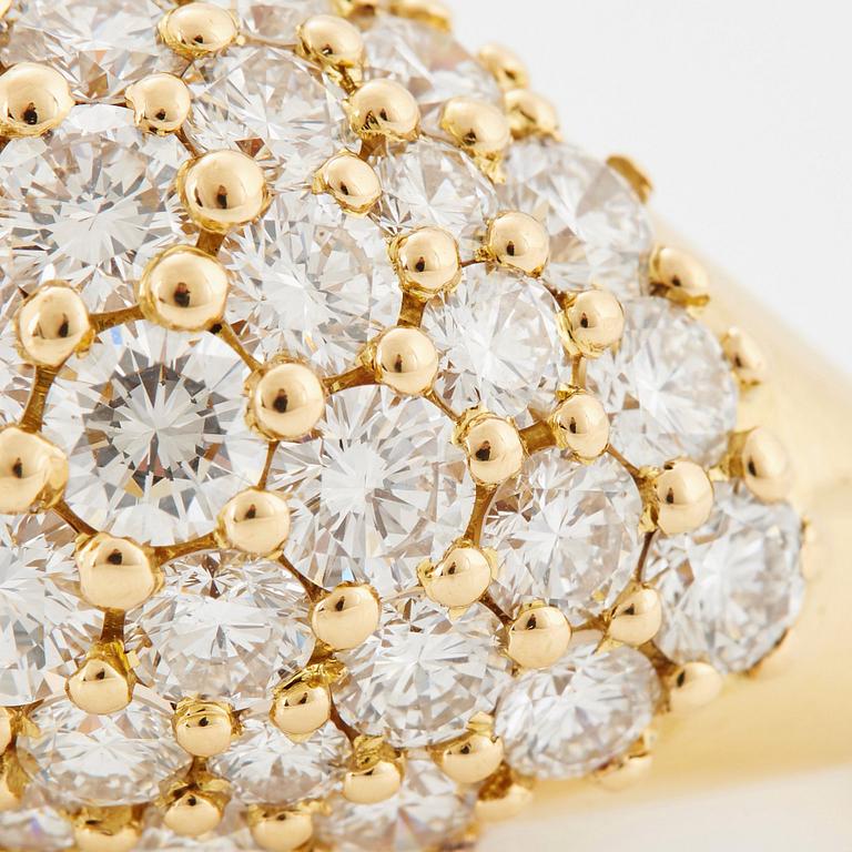 Cartier "Marrakech" an 18K gold bombé ring set with round brilliant-cut diamonds.
