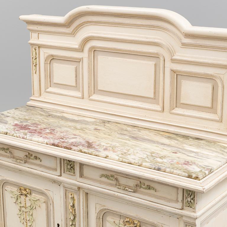 a Louis XVI-style sideboard from the 20th century.