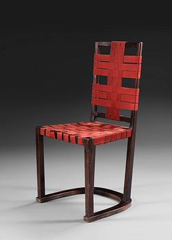 An Axel-Einar Hjorth black stained birch 'Futurum' chair with red girths by NK, Sweden,