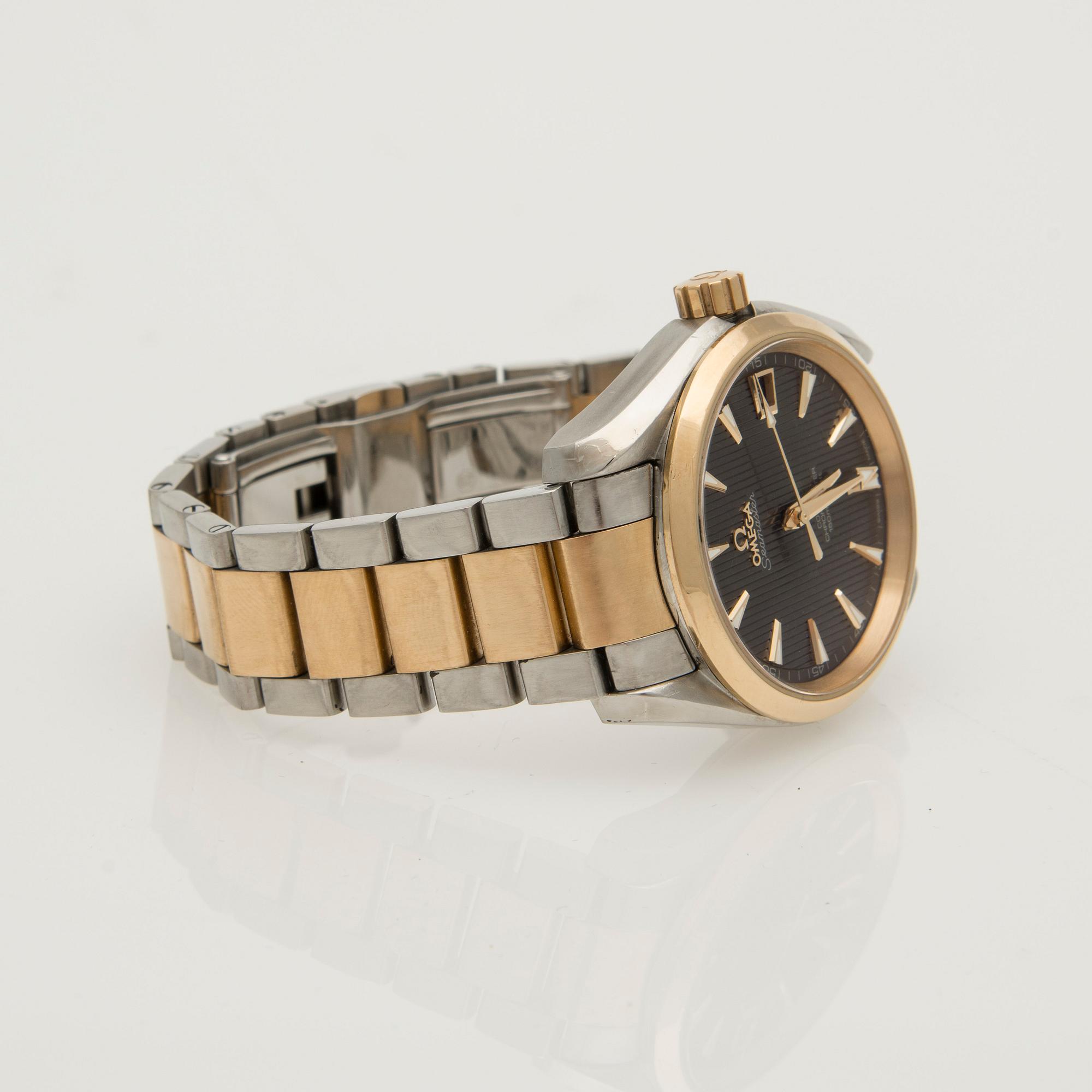 ARMBANDSUR, herr, guld / stål. Omega Seamaster Co Axial Chronometer.