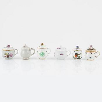 Two dinner plates and 11 custard cups with covers, 18th/20th Century.