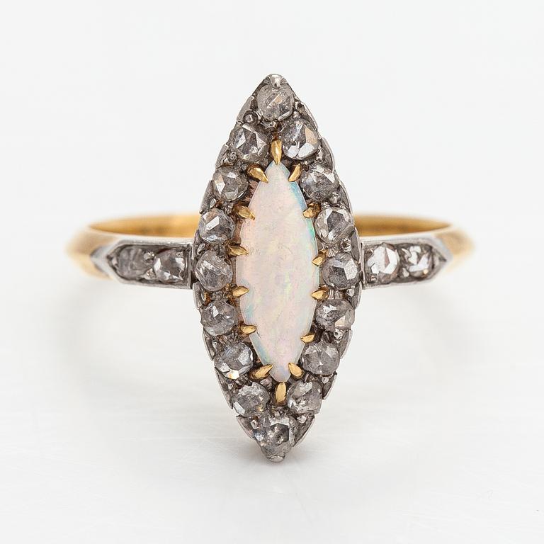 A ca. 18K gold ring with an opal and rose-cut diamonds.