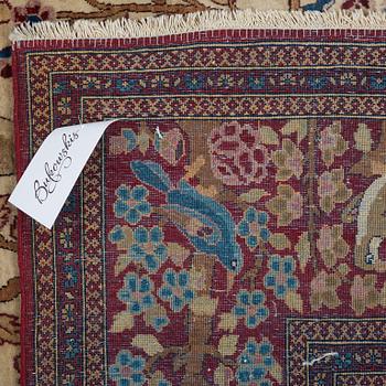 A RUG, a semi-antique Esfahan probably, figural, ca 214,5 x 137,5 cm.