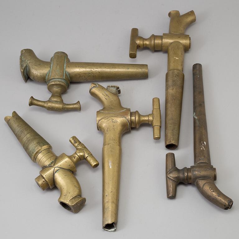 FIVE 19TH CENTURY BRONZE TAPS.