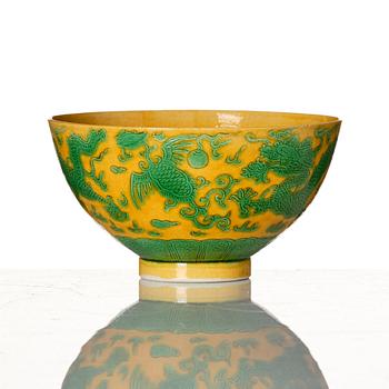 A yellow-ground green-enamelled 'dragon' and phoenix bowl, underglaze blue Daoguang seal mark and of the period.