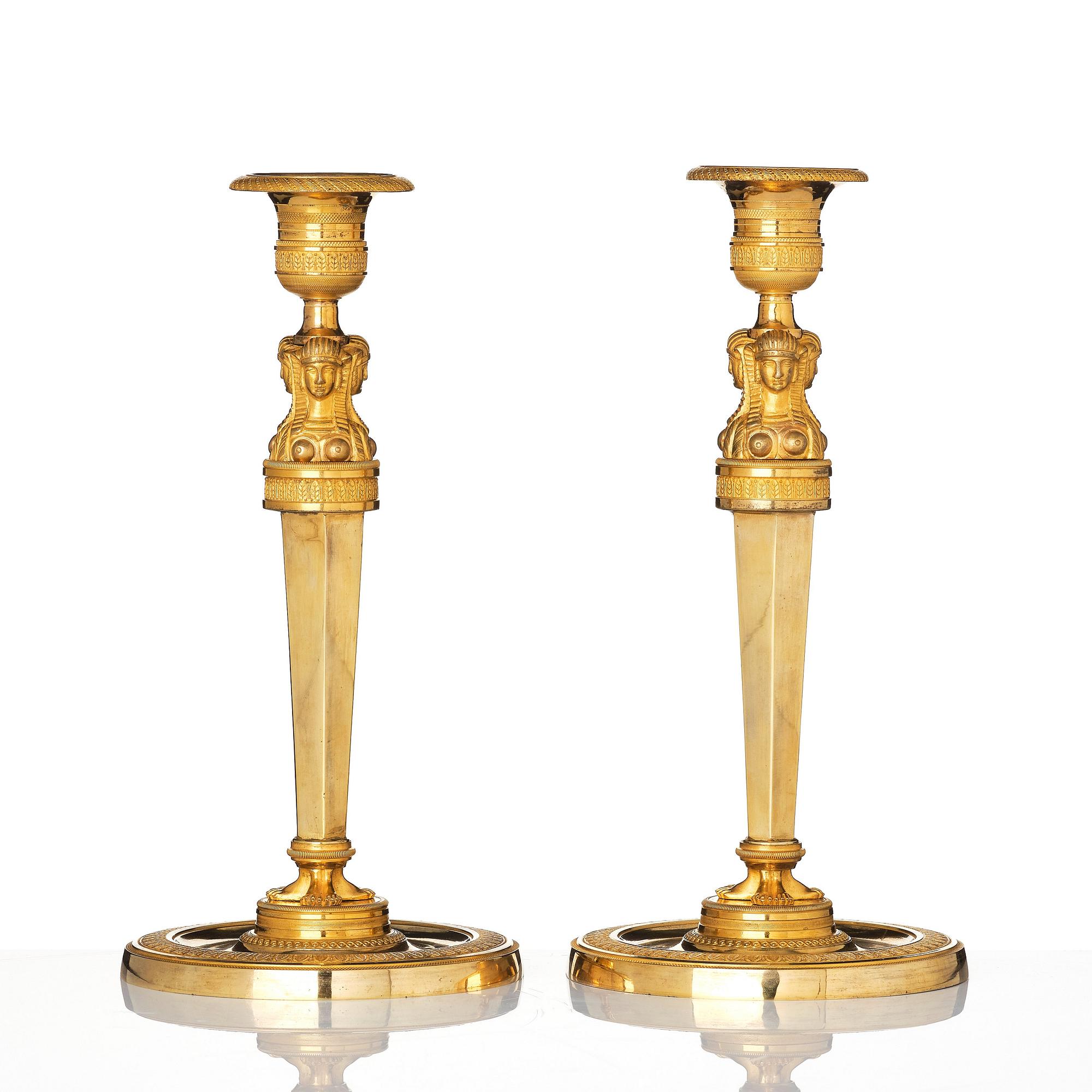A pair of French Empire candlesticks, early 19th century.