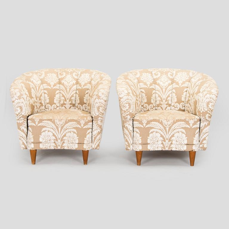 A pair of mid-20th century armchairs.