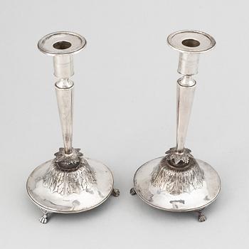 A pair of Swedish Empire silver candlesticks, mark of Gustaf Folcker, Stockholm 1826.