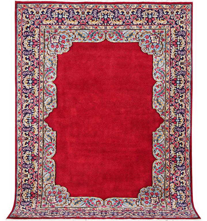 An old Kerman carpet, signed, c. 290 x 208 cm.