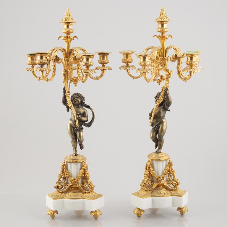 A pair of bronze and marble candelabra, possibly France, late 19th century.