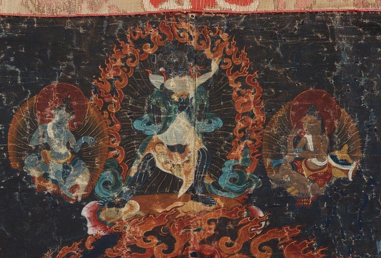 A Tibetan Thangka of Mahakala surrounded by fierce Dharma protectors, 19th century.