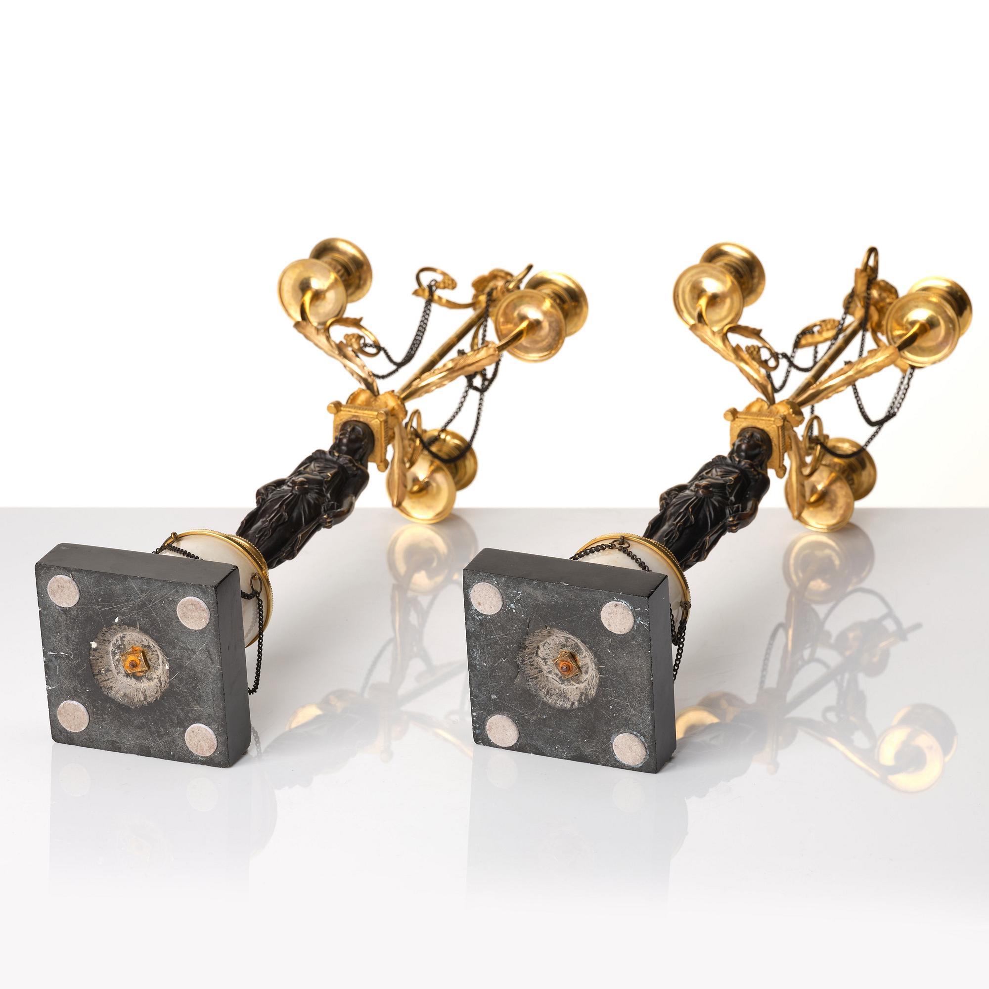 A pair of late Gustavian circa 1800 three-light candelabra, attributed to F L Rung.