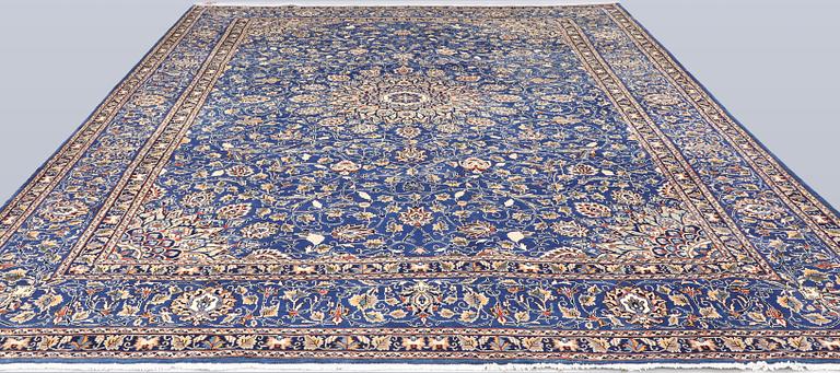 A Kashmar carpet, 408 x 307 cm.