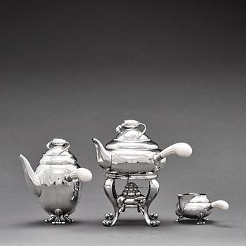 119. Georg Jensen, a three pieces coffee and tea service, "Blossom", Copenhagen Denmark 1915-21 830/1000 silver. Design nr 2,