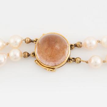 Two strand cultured pearl necklace, 18K gold clasp with rutile quartz.