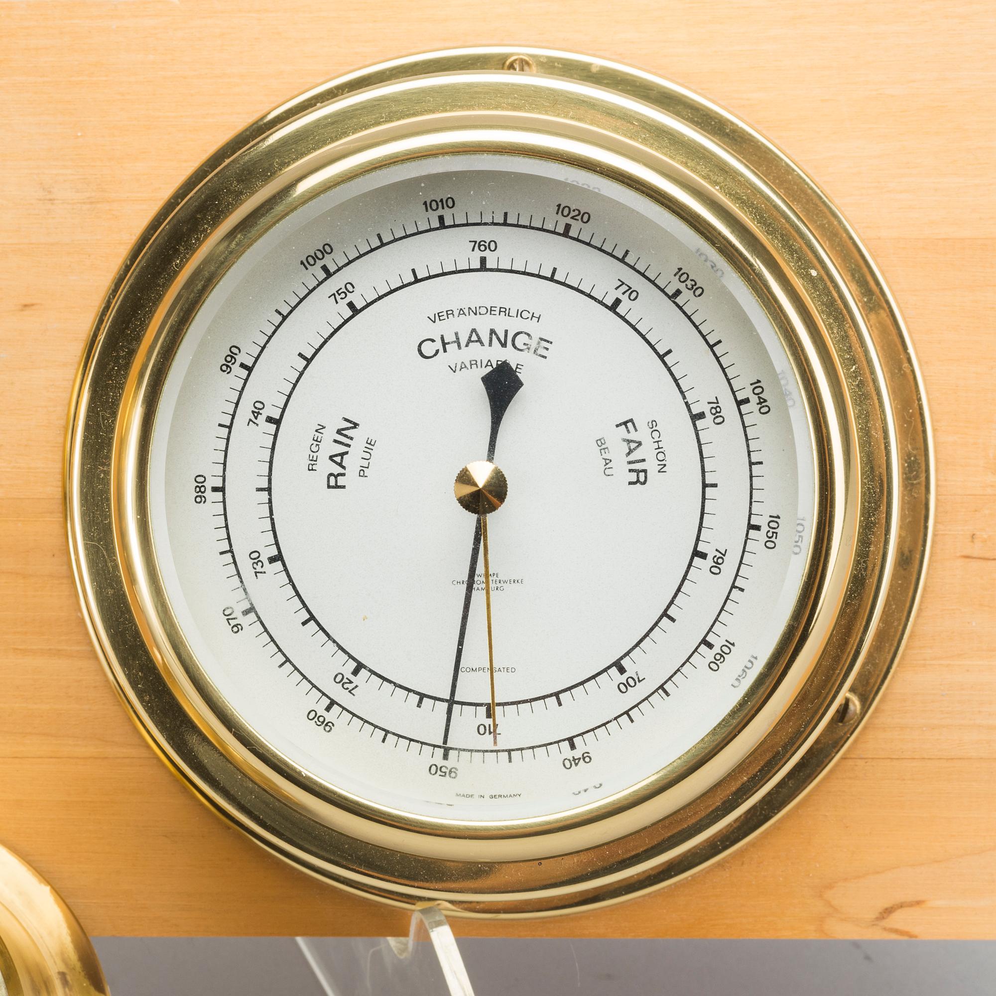 TWO BRASS MARINE CLOCK AND A BAROMETER BY STOCKBURGER.