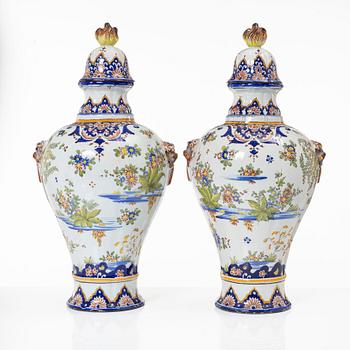 A pair of faience vases with covers, France, 19th century.