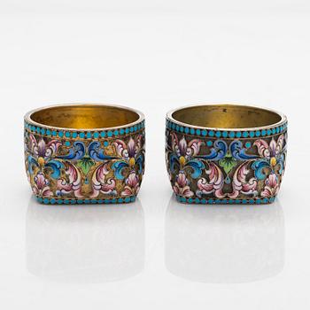 A pair of cloisonné enamel and gilt silver salt cellars, Cyrillic maker's mark F.P, Moscow 1908-26.