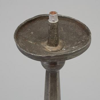 A 17th century pewter candlestick.