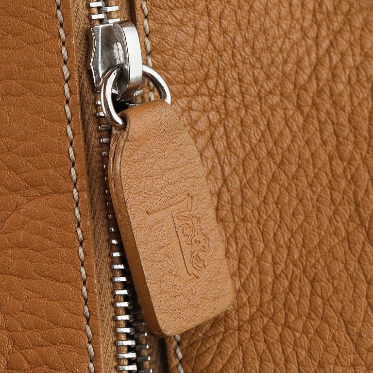 TOD'S, a tan leather bag.