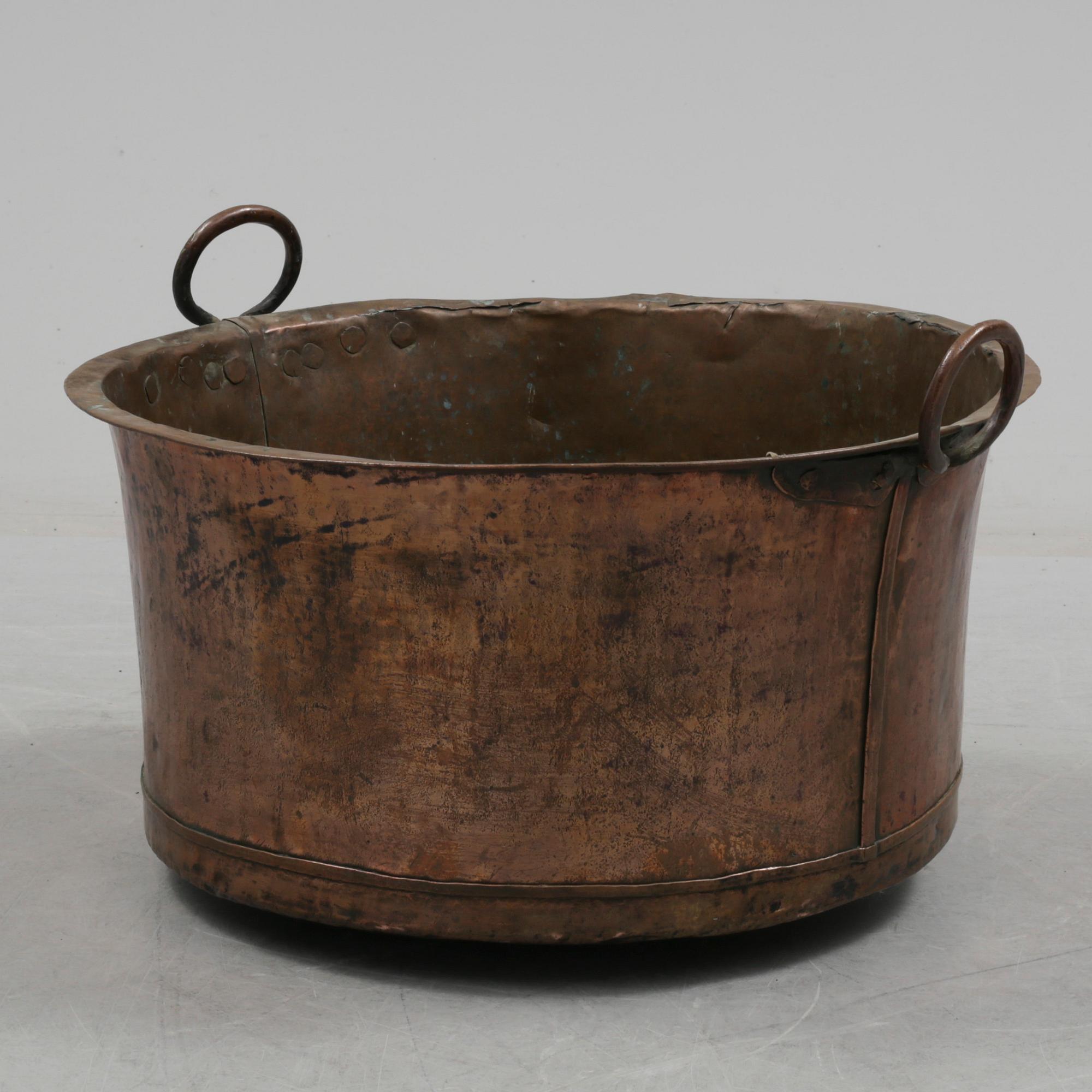 A 19th century copper cauldron.