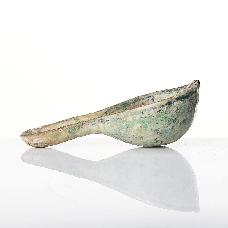 A painted pottery bell and a green glazed spoon, Han dynasty  (202 BC-220 AD).