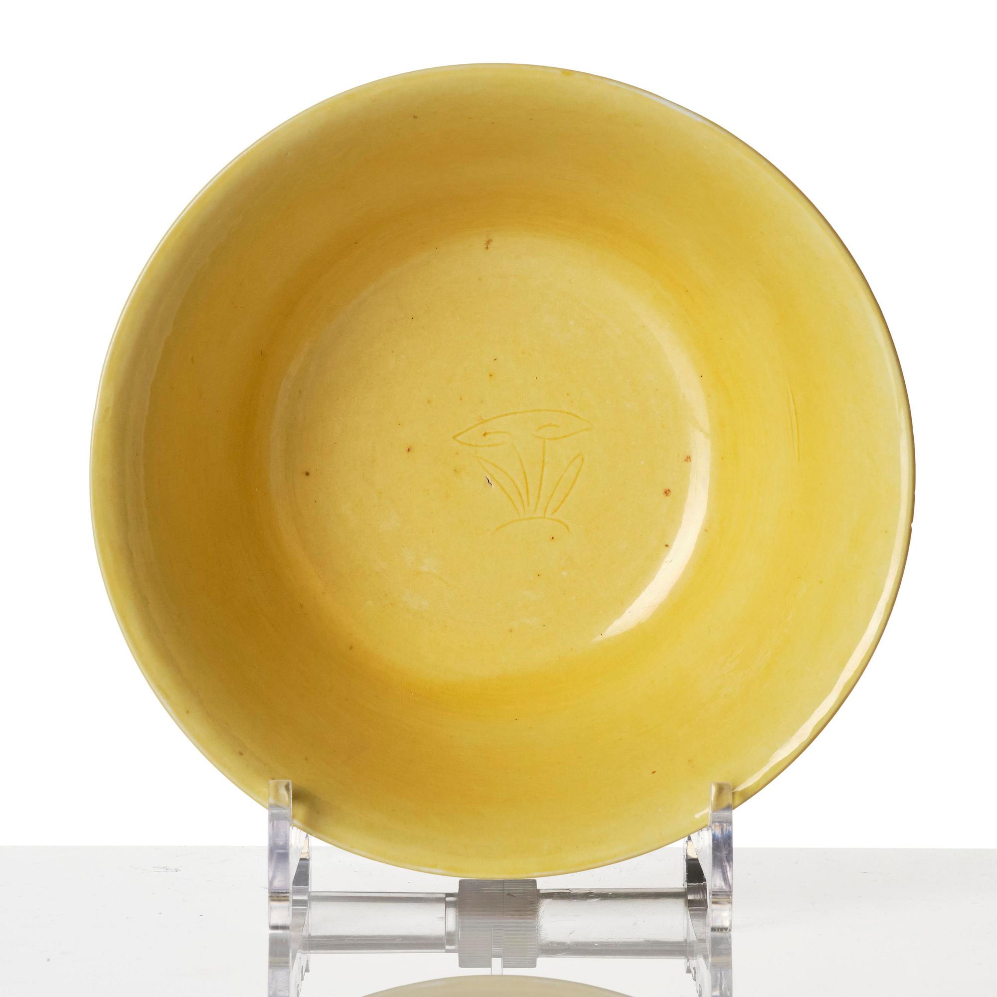 A yellow glazed 'prunus' bowl, Qing dynasty, 18th century.