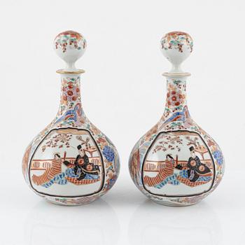 A set of Japanese porcelain bottles with stoppers, early 20th century.